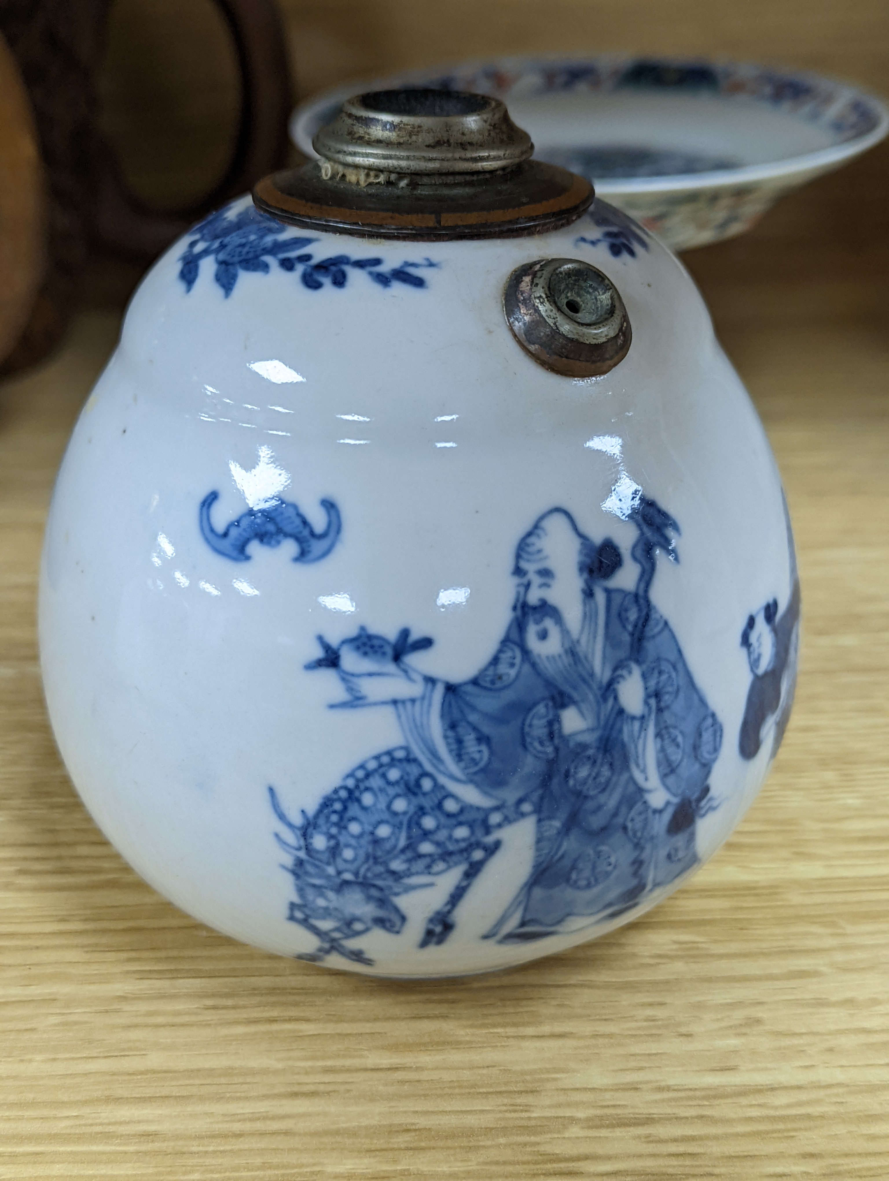 A Chinese blue and white water pipe vessel, a doucai stem dish and a Japanese Imari bowl, 19th century, (3)